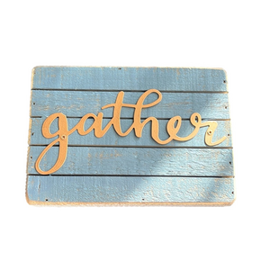 small blue and gold wooden gather sign decor